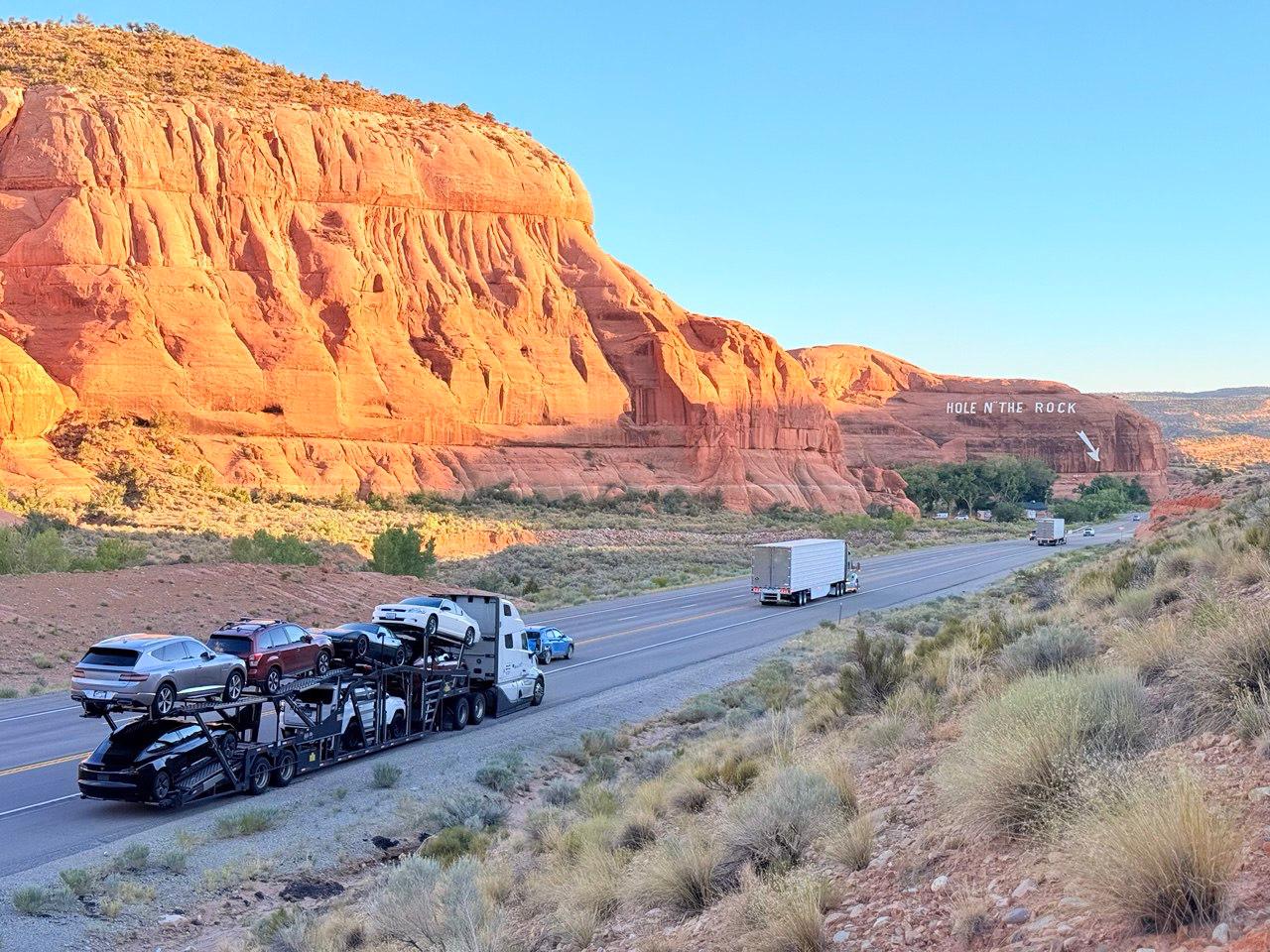 Complete Dharma Express truck and loaded trailer crossing the American West