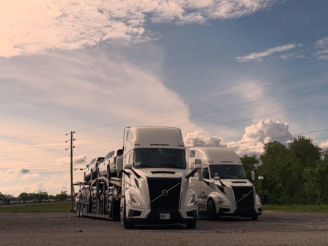 Two complete Dharma Express trucks with loaded auto carrier trailers