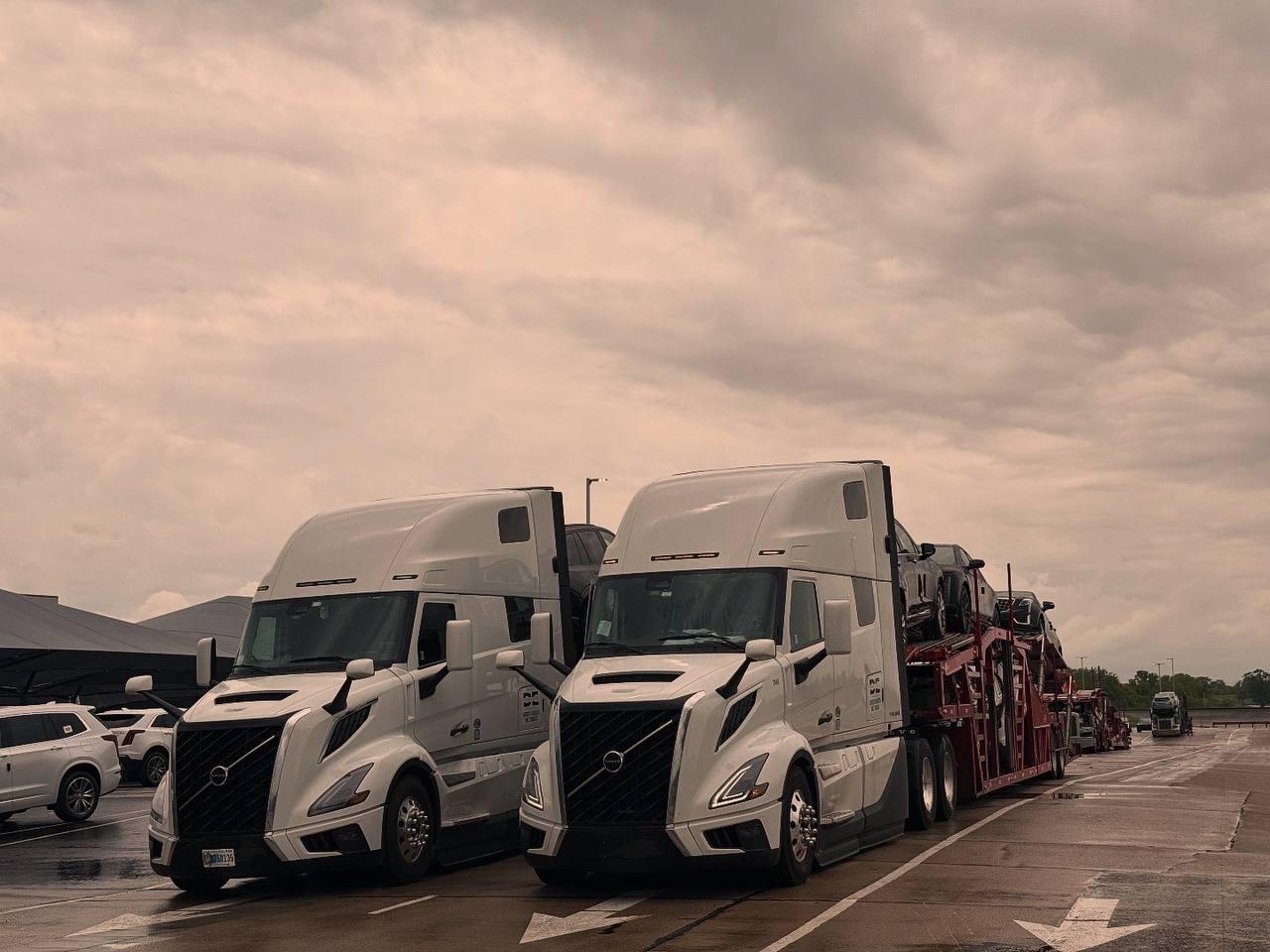 Two loaded Dharma Express trucks ready to depart
